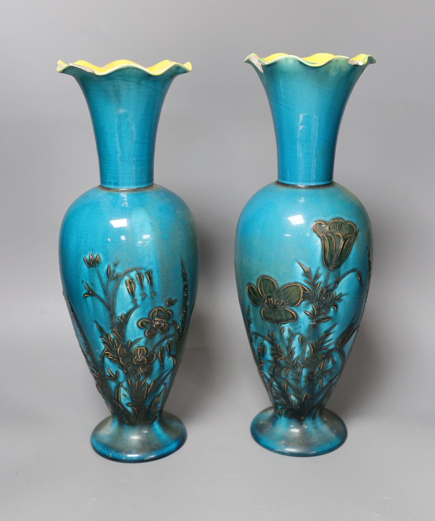 A pair of Linthorpe turquoise glazed pottery vases, impressed model no 2219, incised mark AS, 36cm tall